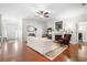 Bright and spacious living room with a cozy fireplace and elegant hardwood flooring at 779 Hamlet Cir, Goose Creek, SC 29445