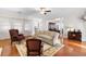 Spacious living room with hardwood floors, stylish furnishings, and an open layout connecting to other rooms at 779 Hamlet Cir, Goose Creek, SC 29445