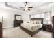 Serene main bedroom features a tray ceiling, neutral decor, and ample natural light at 779 Hamlet Cir, Goose Creek, SC 29445