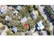 Aerial view of home nestled among lush trees in a neighborhood setting at 8 Fairway Oaks Ln, Isle of Palms, SC 29451