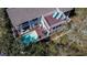Stunning aerial view of a two-story home featuring a private pool, multiple decks, and lush landscaping at 8 Fairway Oaks Ln, Isle of Palms, SC 29451