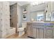 Traditional-style bathroom with shower, tub, decorative art, and light and bright decor at 8 Fairway Oaks Ln, Isle of Palms, SC 29451