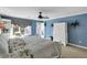 Spacious bedroom with a private door to the backyard, light blue walls, and a ceiling fan at 8 Fairway Oaks Ln, Isle of Palms, SC 29451