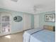 Inviting bedroom with light and bright decor, a ceiling fan, and a private balcony at 8 Fairway Oaks Ln, Isle of Palms, SC 29451