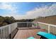 Upper deck offers a partial treetop view, deck chairs, and sunshine at 8 Fairway Oaks Ln, Isle of Palms, SC 29451