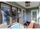 Relax on this deck with a view of the tree tops from comfortable outdoor furniture at 8 Fairway Oaks Ln, Isle of Palms, SC 29451