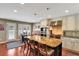 Modern kitchen featuring a large island, stainless steel appliances, and custom cabinetry at 8 Fairway Oaks Ln, Isle of Palms, SC 29451