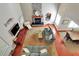 Spacious living room featuring a stone fireplace, hardwood floors, and comfortable seating at 8 Fairway Oaks Ln, Isle of Palms, SC 29451