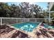 Inviting in-ground pool surrounded by a wood deck and white fence, perfect for relaxation at 8 Fairway Oaks Ln, Isle of Palms, SC 29451