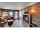Comfortable room with brick walls and a fireplace at 8 Fairway Oaks Ln, Isle of Palms, SC 29451