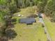 Aerial view of a home with a pool, carport, and outbuilding, showcasing the property's amenities and layout at 8072 Bing Hill Road Rd, Adams Run, SC 29426