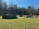 Backyard features an above ground pool, fire pit, and outdoor seating area perfect for entertaining at 8072 Bing Hill Road Rd, Adams Run, SC 29426
