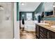 Bathroom featuring a tub, shower, and a dark vanity with a light countertop and a neutral patterned tile floor at 8072 Bing Hill Road Rd, Adams Run, SC 29426