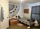 Cozy bedroom with unique wall art, comfortable bed, and storage options at 8072 Bing Hill Road Rd, Adams Run, SC 29426