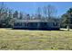Ranch style home with covered front porch and mature trees at 8072 Bing Hill Road Rd, Adams Run, SC 29426