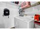 Laundry room features a white washer and dryer set, wire shelving and white walls at 8072 Bing Hill Road Rd, Adams Run, SC 29426