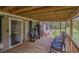 Charming front porch with comfortable seating, ideal for enjoying the outdoors at 8072 Bing Hill Road Rd, Adams Run, SC 29426