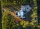 Aerial view of a stunning home with a pool, surrounded by lush green lawns and dense trees at 821 Bulls Bay Blvd, Mount Pleasant, SC 29429