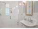 Bright bathroom with modern white tile shower, rainfall shower head, and a unique pedestal sink at 821 Bulls Bay Blvd, Mount Pleasant, SC 29429