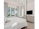 Bedroom with four-poster bed and a view of the lush, green landscape at 821 Bulls Bay Blvd, Mount Pleasant, SC 29429