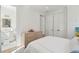 Bright bedroom featuring ensuite bath access, stylish dresser and a large closet at 821 Bulls Bay Blvd, Mount Pleasant, SC 29429