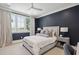 Cozy bedroom with lake views from the windows, gray walls, and elegant furnishings at 821 Bulls Bay Blvd, Mount Pleasant, SC 29429