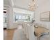 Dining room with view into a bright, modern kitchen and a water view at 821 Bulls Bay Blvd, Mount Pleasant, SC 29429