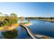 Scenic golf course view featuring a wooden bridge connecting to a tranquil island surrounded by serene blue waters at 821 Bulls Bay Blvd, Mount Pleasant, SC 29429