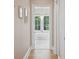 Hallway view of a modern bathroom with a soaking tub and view of trees outside the window at 821 Bulls Bay Blvd, Mount Pleasant, SC 29429
