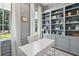 Home office featuring built-in shelving, a white desk, and a window with natural light at 821 Bulls Bay Blvd, Mount Pleasant, SC 29429