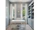 Gray home office featuring built-in shelving, a white desk, and two windows at 821 Bulls Bay Blvd, Mount Pleasant, SC 29429