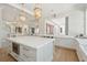 Open-concept kitchen featuring a large island, pendant lighting, and modern appliances at 821 Bulls Bay Blvd, Mount Pleasant, SC 29429