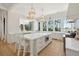 Spacious white kitchen with a large center island, pendant lighting, and scenic views from multiple windows at 821 Bulls Bay Blvd, Mount Pleasant, SC 29429