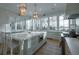 Open kitchen with a large island, bright natural light, and stainless steel appliances at 821 Bulls Bay Blvd, Mount Pleasant, SC 29429