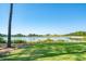 Scenic lake view showcasing a lush green lawn and distant views of the water and surrounding nature at 821 Bulls Bay Blvd, Mount Pleasant, SC 29429