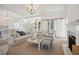Inviting living room featuring hardwood floors, a fireplace, and an open staircase at 821 Bulls Bay Blvd, Mount Pleasant, SC 29429
