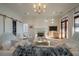 Bright living room with a fireplace, hardwood floors, and comfortable seating arrangement at 821 Bulls Bay Blvd, Mount Pleasant, SC 29429