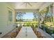 Relaxing screened patio with golf course and lake views, perfect for outdoor dining and entertaining at 821 Bulls Bay Blvd, Mount Pleasant, SC 29429