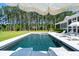 Beautiful pool with umbrellas and sunning chairs on a sunny day with wooded backdrop at 821 Bulls Bay Blvd, Mount Pleasant, SC 29429