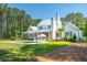 Sprawling backyard with an in-ground pool, screened porch, and pristine landscaping, perfect for outdoor living at 821 Bulls Bay Blvd, Mount Pleasant, SC 29429