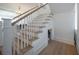 Elegant staircase with white railings and wood treads, leading to the upper level of the home at 821 Bulls Bay Blvd, Mount Pleasant, SC 29429