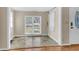 Sunlit dining room featuring tile flooring and a view of the front yard through a large window at 834 Prince John Dr, Charleston, SC 29407