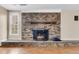 Inviting living room with a prominent brick fireplace and wood floors at 834 Prince John Dr, Charleston, SC 29407