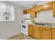 Compact kitchen featuring wood cabinets and a white electric range at 834 Prince John Dr, Charleston, SC 29407