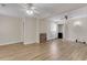 Open living room featuring luxury vinyl plank flooring, ceiling fans, and closet at 834 Prince John Dr, Charleston, SC 29407