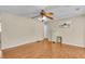 Bright living room featuring hardwood floors, neutral walls, and a classic ceiling fan at 834 Prince John Dr, Charleston, SC 29407