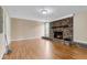 Spacious living room with hardwood floors and classic brick fireplace at 834 Prince John Dr, Charleston, SC 29407