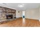 Bright living room with hardwood floors and a charming brick fireplace at 834 Prince John Dr, Charleston, SC 29407