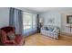 Inviting living room with hardwood floors and lots of natural light from the big window at 8341 Delhi Rd, North Charleston, SC 29406