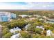 Scenic aerial view showcasing a vibrant neighborhood with lush trees, and winding roads at 94 Seaside Cottage Ln, Isle of Palms, SC 29451